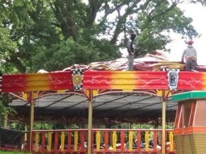 Arthur and team pull the roof on the Dodgem Cars - water proof and soon to be ready for action!