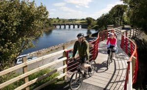 Westport to Achill Great Western Greenway. Cyclists enjoy the beautiful surrounds of the landscape at the Burrishoole Bridge section of the Greenway. Pic: Michael Mc Laughlin