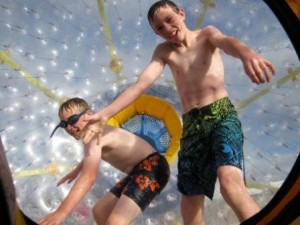 Teens in Water Zorb Ride