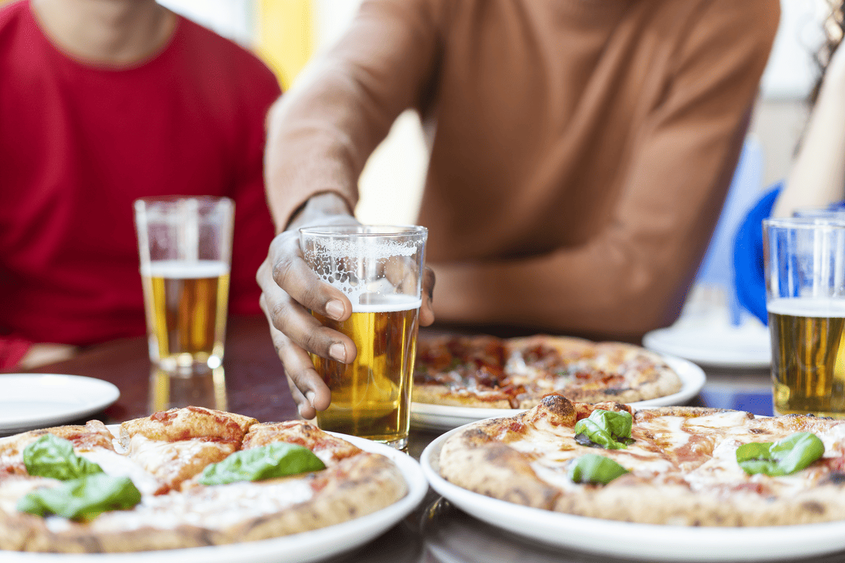 Enjoy fresh woodfire pizza with a pint of beer or glass of wine with our Summer Happy Hour 